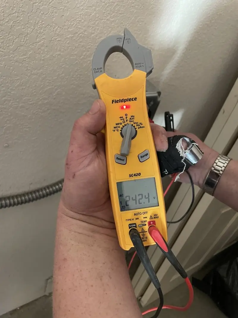 Voltage testing with clamp meter during Outlet Installation in Westland
